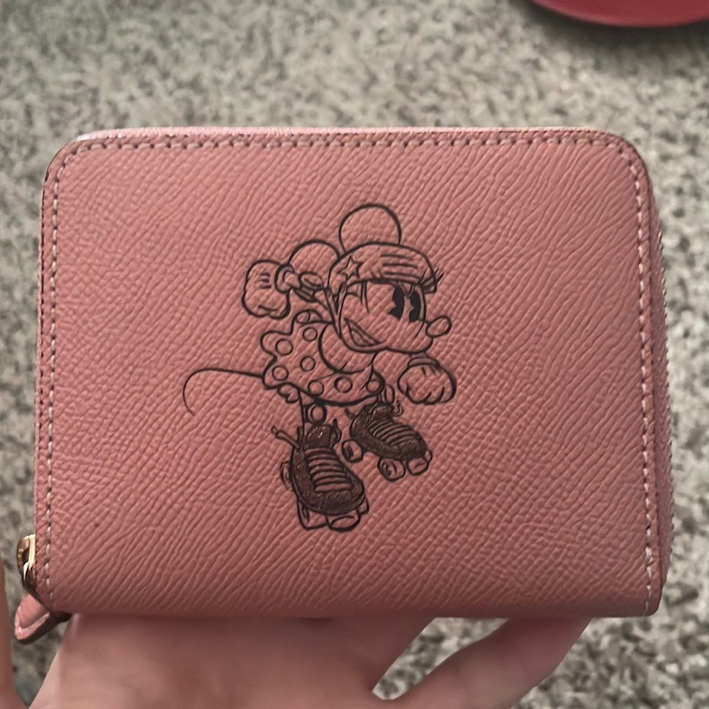 Pink coachxdisney Minnie Mouse on roller skates wallet.